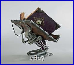 28-728630 Katherine's Collection Skeleton Holder withWitches Spellbook Halloween