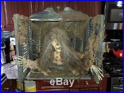 Animated Mechanical Creegan Skeleton In Window Halloween Store Display Ghost