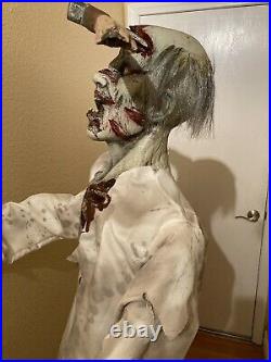 Spirit Halloween Axe'd Zombie Life Size 6 ft. Figure Prop Same Day Ship Retired
